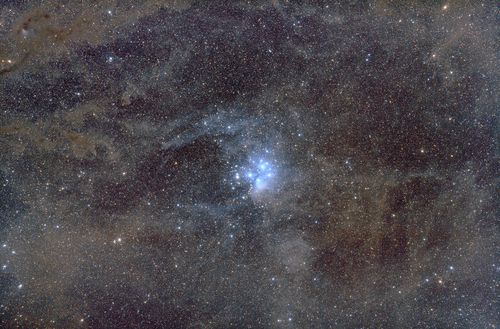 Pleiades cluster wrapped in interstellar dust